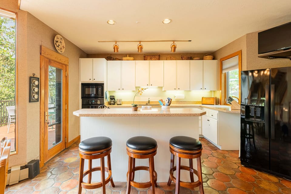 Kitchen island with barstool seating for 3