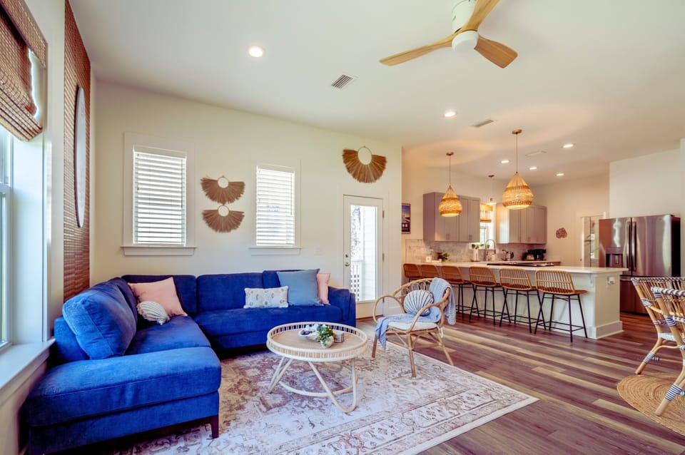 Cozy living room with comfy seating and smart TV—ideal for relaxing after a beach day