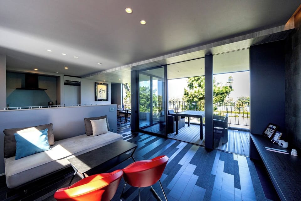 The living room is bathed in soft sunlight, promising high-quality relaxation.