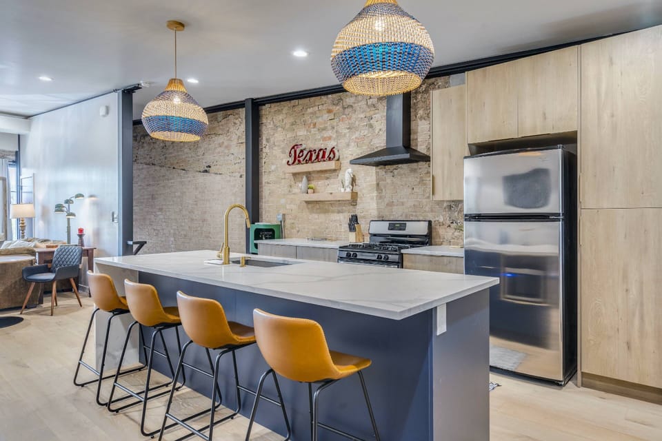 Gourmet kitchen with stainless steel appliances and bar seating