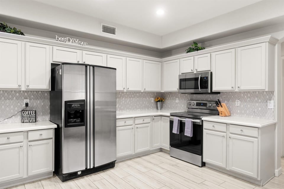 Whip up your favorite meals in this sparkling, fully stocked kitchen—where every detail says best day ever (and yes, the coffee's always waiting).