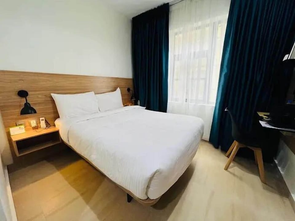 Economy Apartment, Balcony, City View | Desk, laptop workspace, blackout drapes, soundproofing
