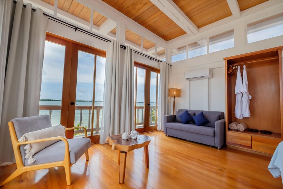 Lounge by the windows and watch the water shimmer.