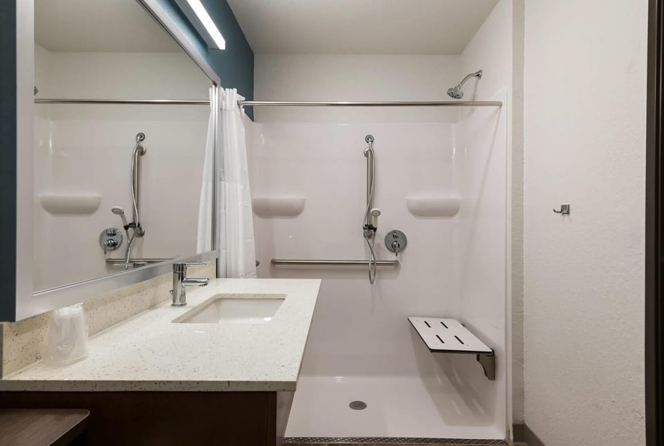 Refresh in a bright, accessible shower with spacious vanity.