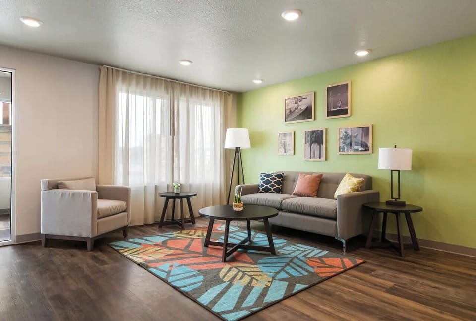 Relax on plush seating in a bright, modern lounge.