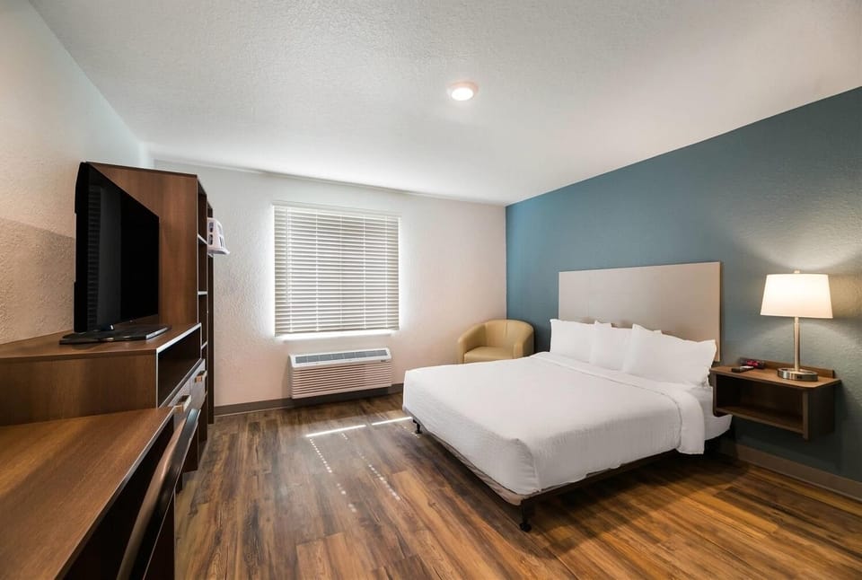 Unwind in crisp linens with TV and easy comfort.