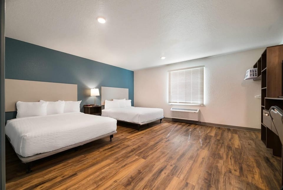 Stretch out with two comfy beds in a bright room.