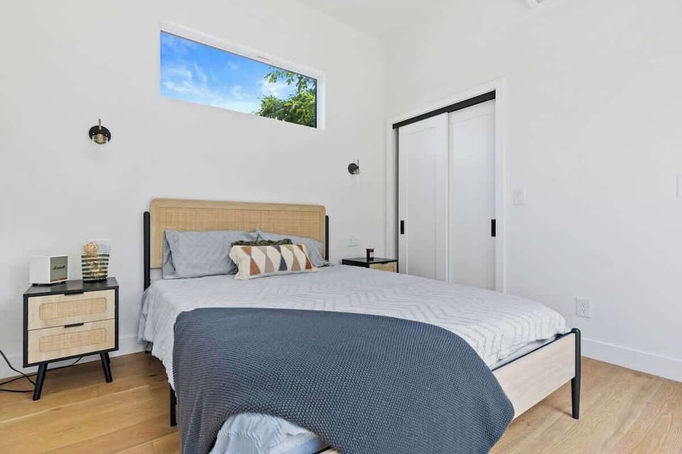 Bright, minimalist bedroom designed for deep rest.