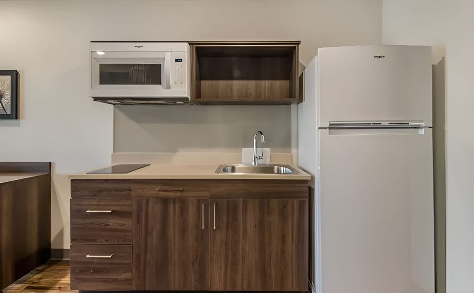Enjoy extra convenience with sink, cooktop, and roomy refrigerator.