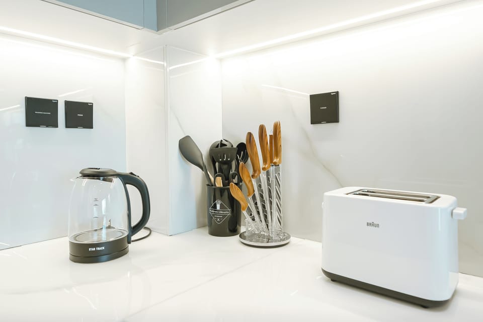 Luxury Apartment | Private kitchen | Full-size fridge, microwave, oven, stovetop