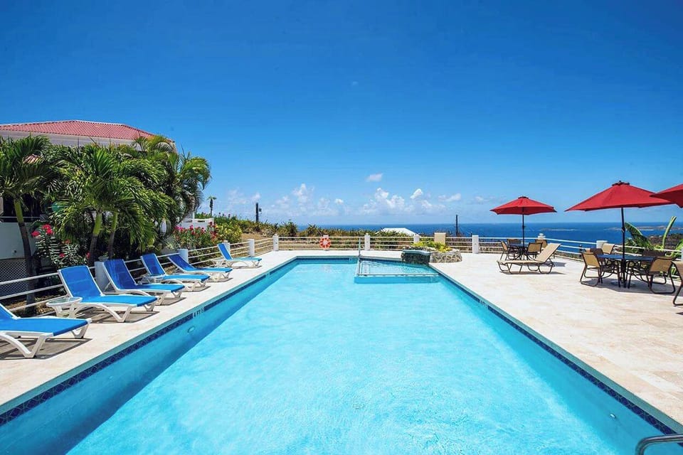 The expansive sundeck and pool are shared and have gorgeous panoramic views