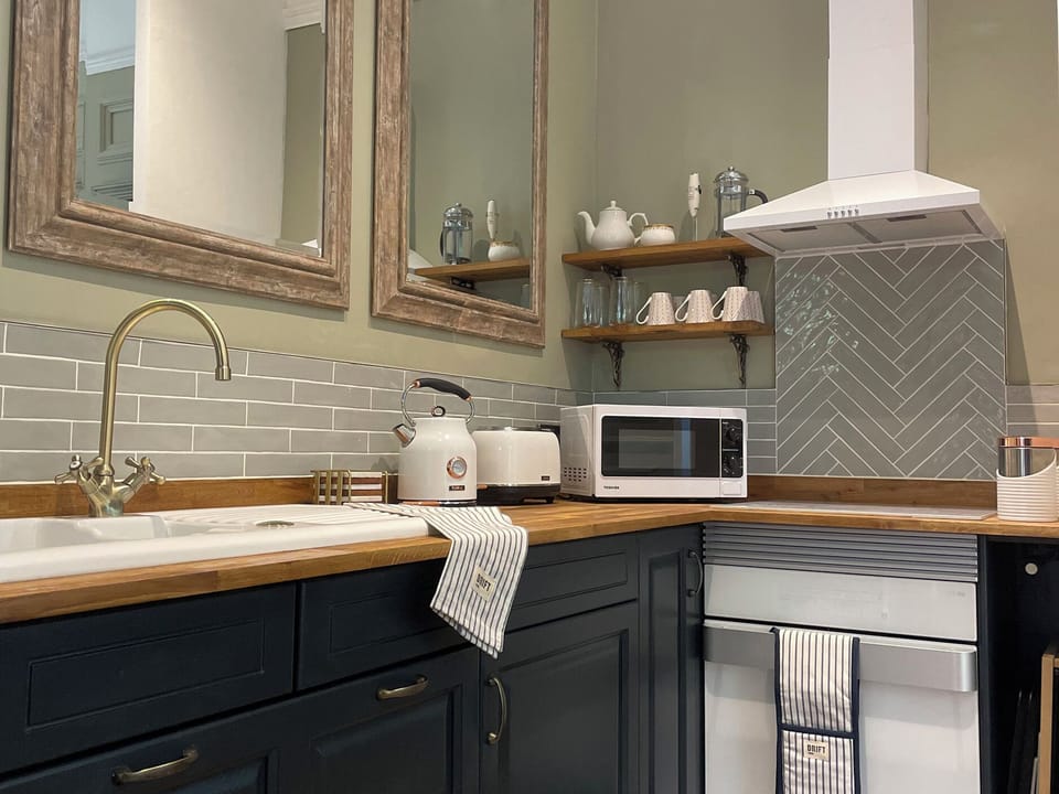 Fridge, microwave, cookware/dishes/utensils
