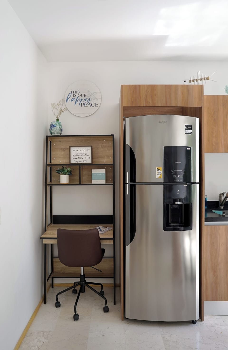 Refrigerator and small adjacent office desk for your working needs 