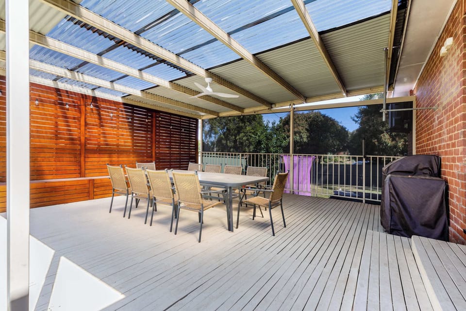 Large undercover decking area featuring outdoor dining setting sitting up to 10 guests plus BBQ.
