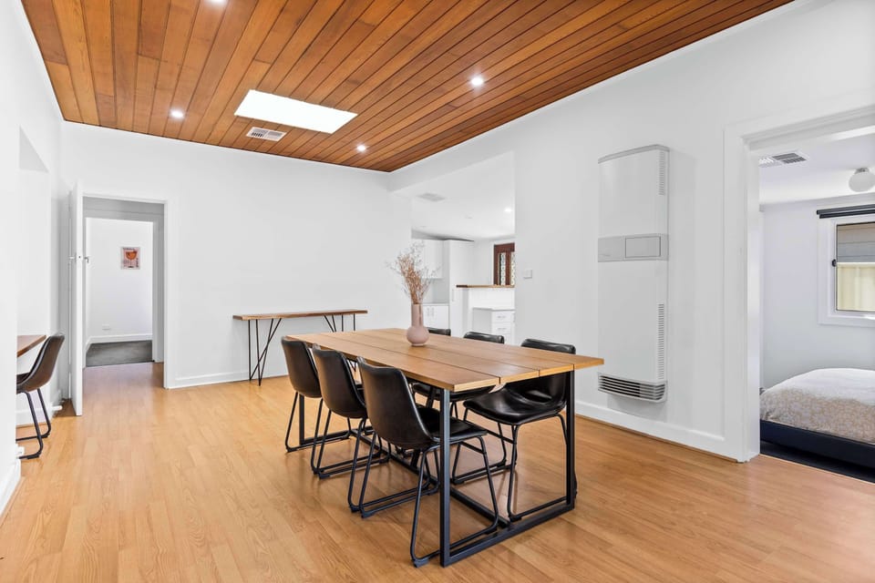 Dining Room featuring gorgeous timber panelled ceiling, dining suite sitting up to six guests and designated work bench zone.
