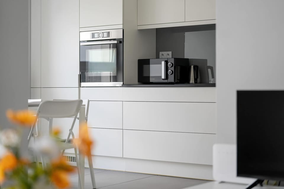 Practical kitchen with white finishes.