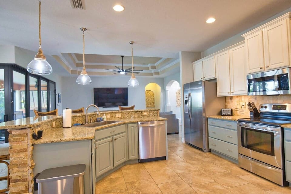 Fully stocked entertainment ready chef kitchen.