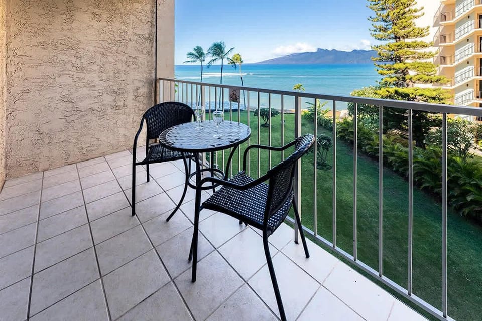 Outdoor lanai with ocean and garden views. Whale watching in distance (seasonally) 