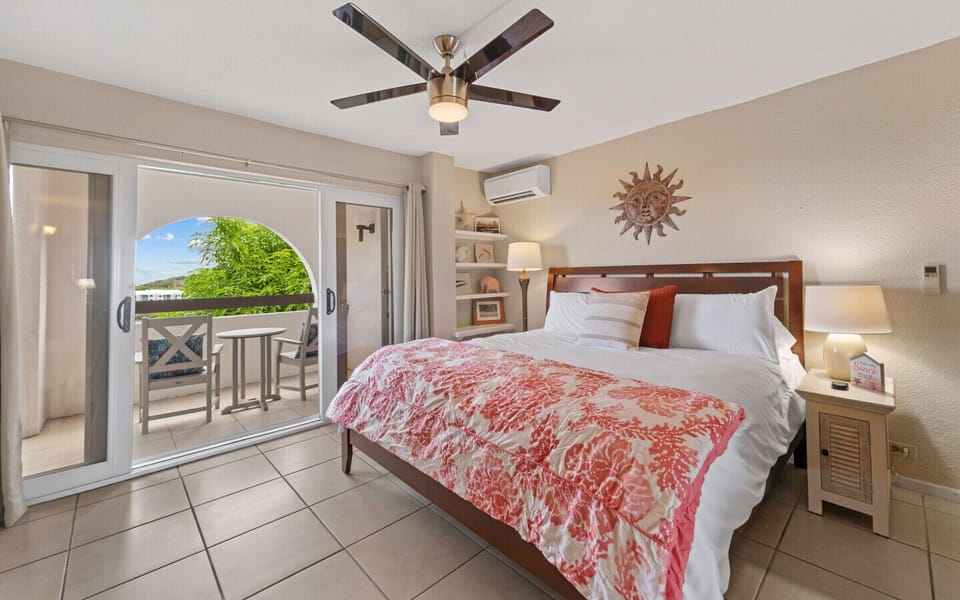 Bedroom 1 - ensuite bath, king bed,  balcony access, flat screen TV and cold AC.