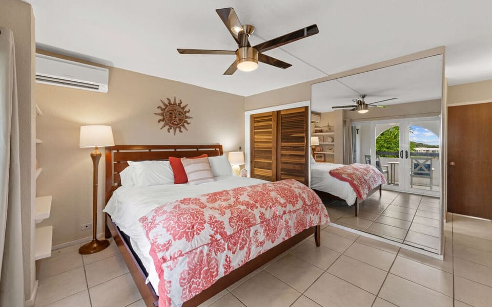 Bedroom 1 - ensuite bath, king bed,  balcony access, flat screen TV and cold AC.