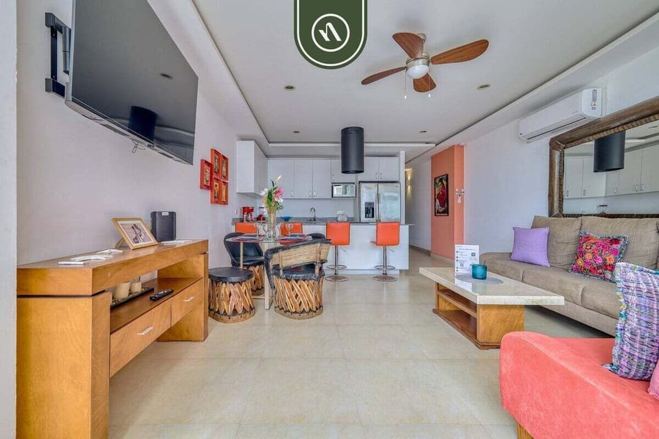 Enjoy the seamless flow of this open floor plan. Watch TV in the living area, dine at the traditional table, or grab a drink at the kitchen bar.