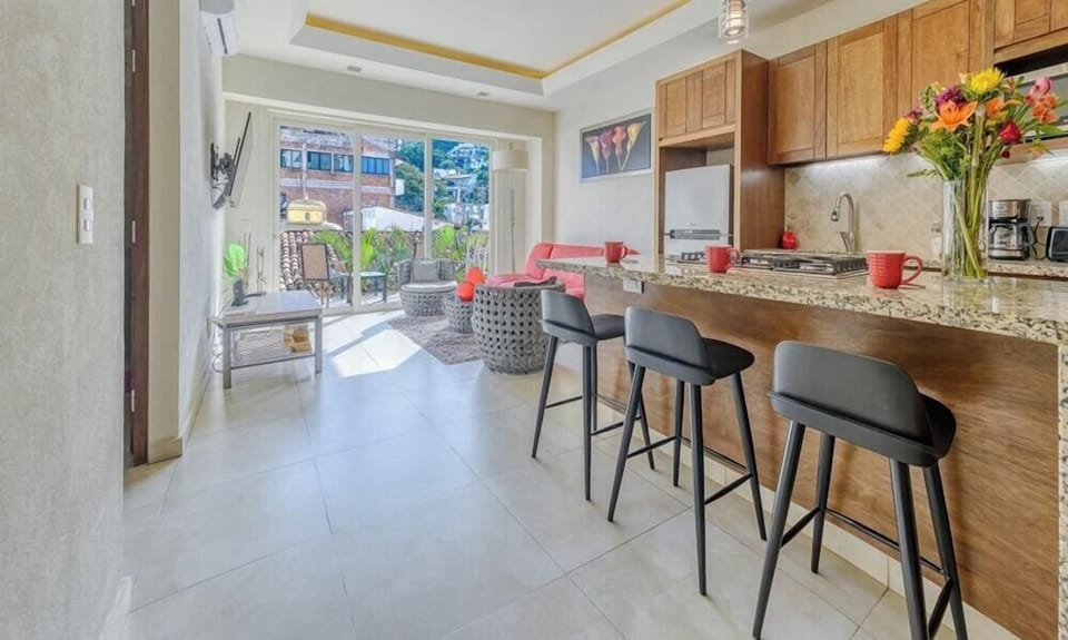 Enjoy the fantastic flow of this bright and airy apartment. The spacious layout perfectly connects the fully equipped kitchen and breakfast bar directly to the living area and outdoor balcony, making it an ideal space for socializing and relaxing.