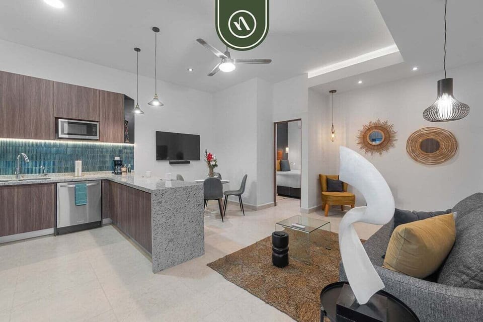 Enjoy the seamless flow of this stylish open-concept condo. The comfortable living area connects directly to a fully equipped modern kitchen with a large granite breakfast bar.