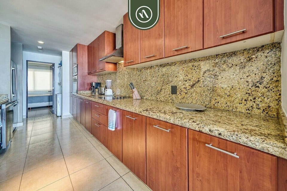 Spacious fully equipped kitchen featuring ample counter space, modern appliances, and everything needed to prepare meals during your stay.