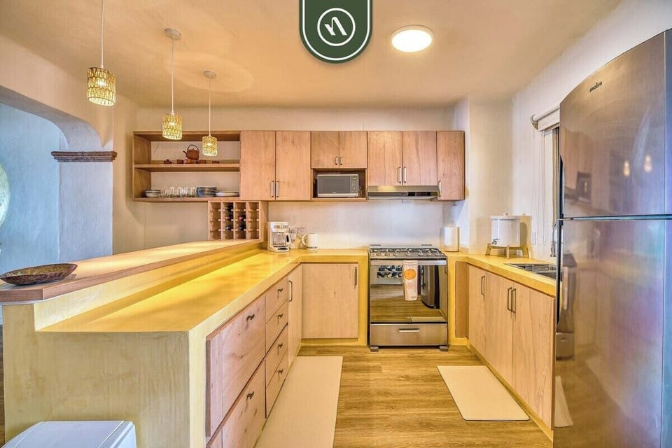 Modern kitchen with stainless steel appliances and ample workspace.