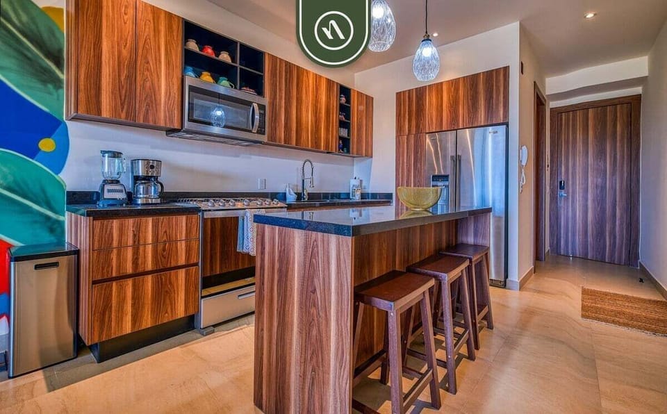 Fully equipped kitchen with granite countertops and premium appliances.