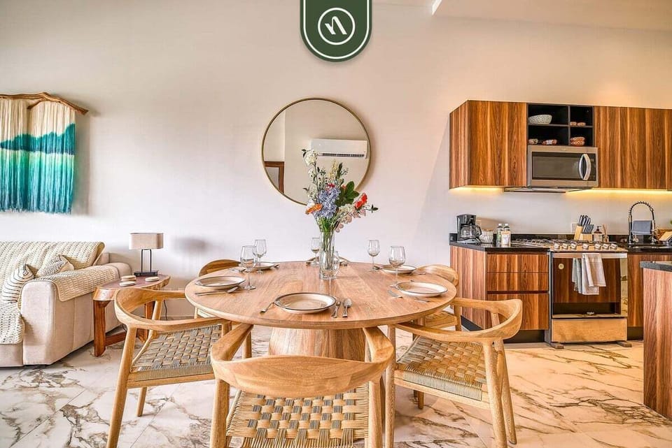 Cozy living area with comfortable furnishings and integrated kitchen access.