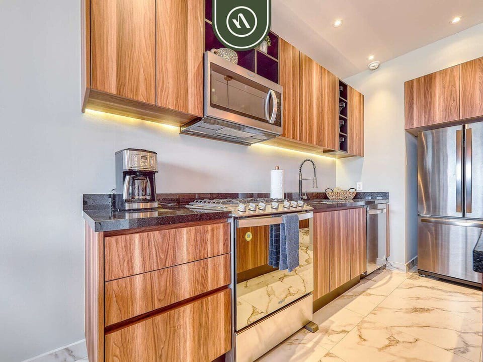 Fully equipped kitchen with granite countertops and premium appliances.