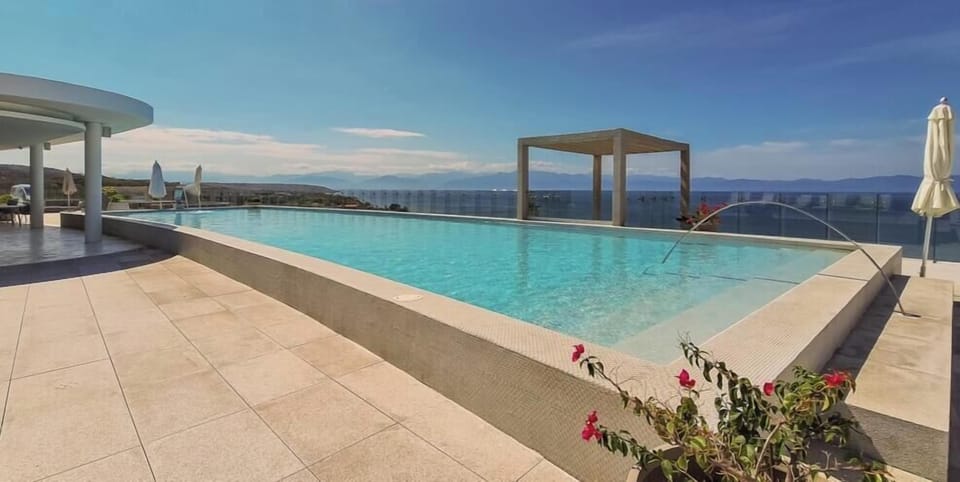 Take a refreshing dip while enjoying breathtaking views from this stunning rooftop infinity pool.