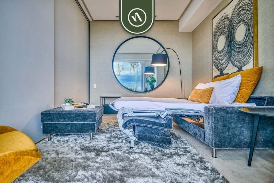 Spacious bedroom with plush king-size bed, designer interiors, and a calm, luxurious ambiance.
