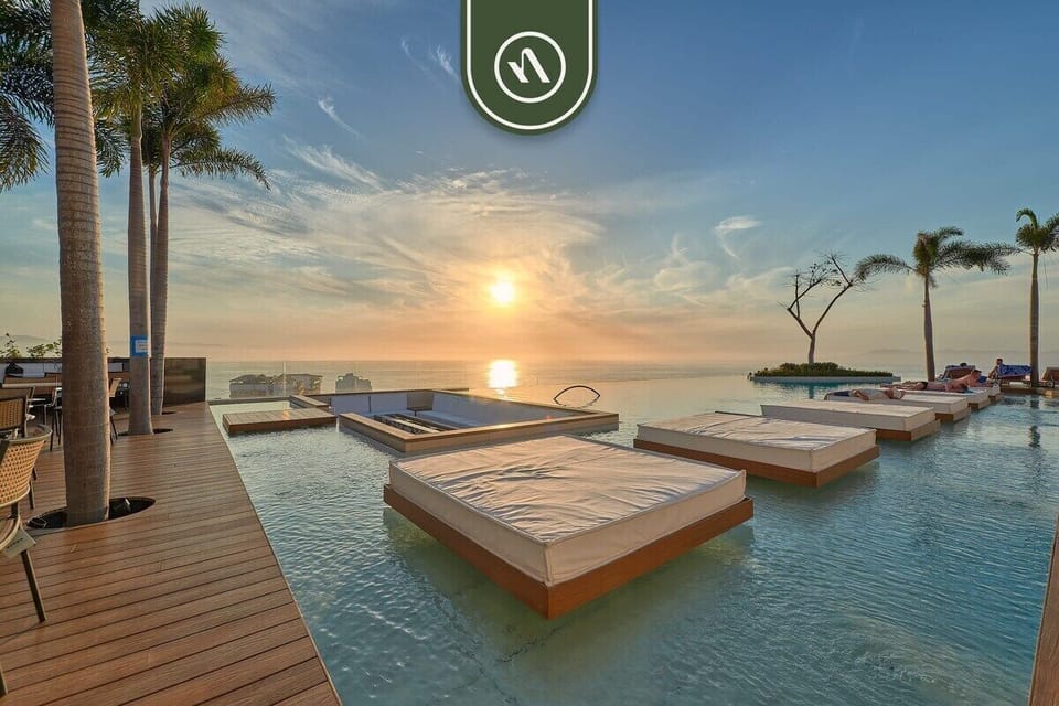 Spectacular infinity pool overlooking the ocean with luxury lounge areas and a serene resort-style atmosphere.