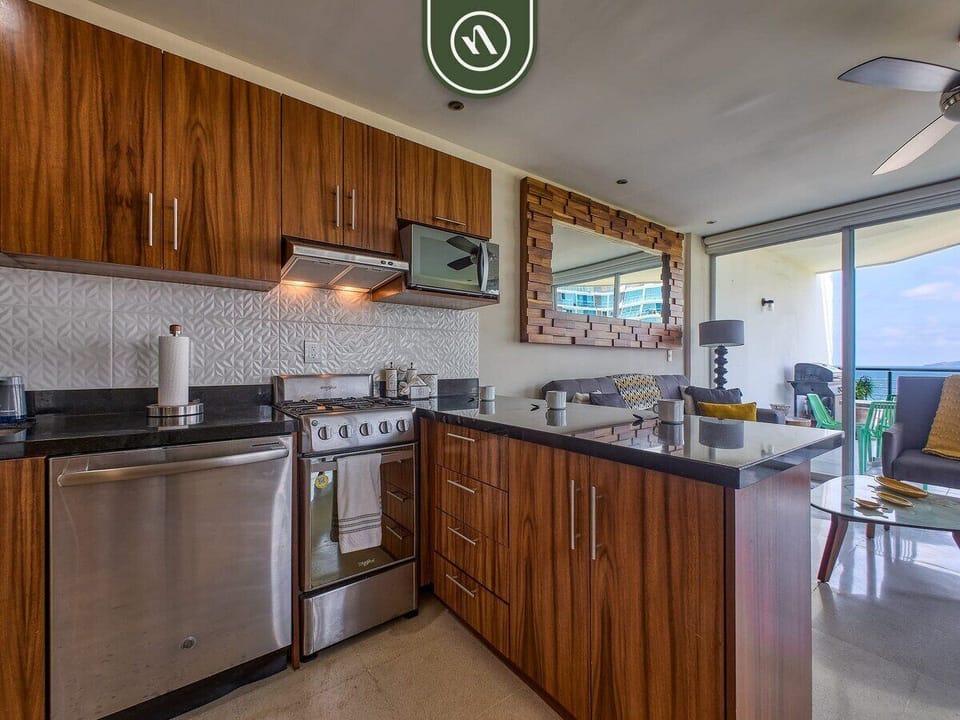 Prepare meals with ease in the modern kitchen featuring full-size appliances, ample counter space, and everything needed for a comfortable stay.