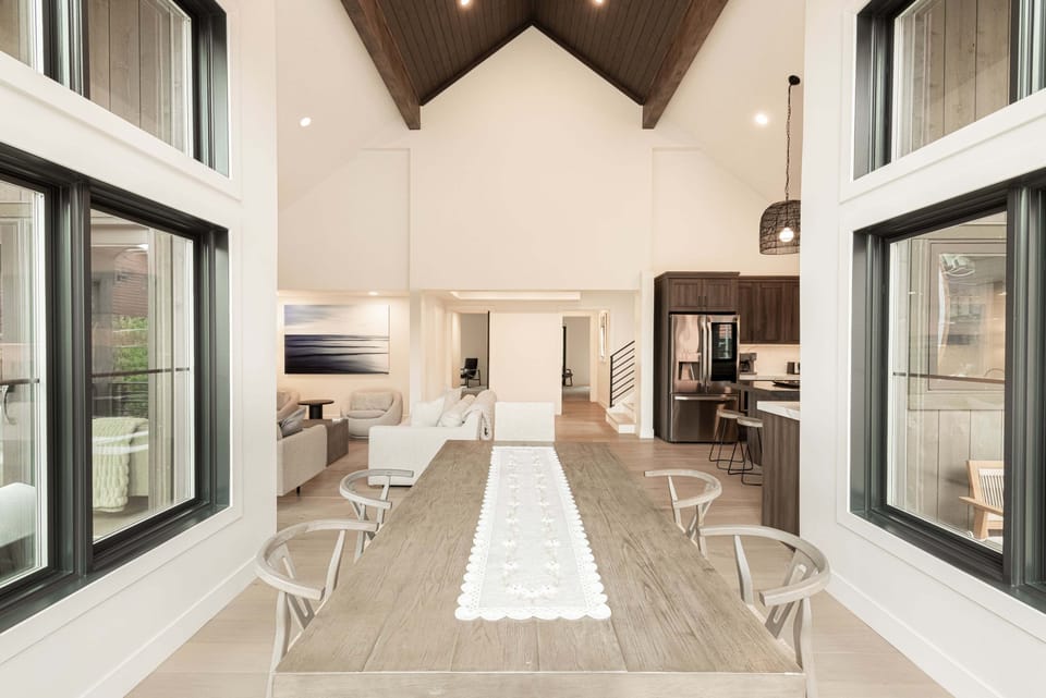 Dining Table surrounded by Floor-to-Ceiling windows