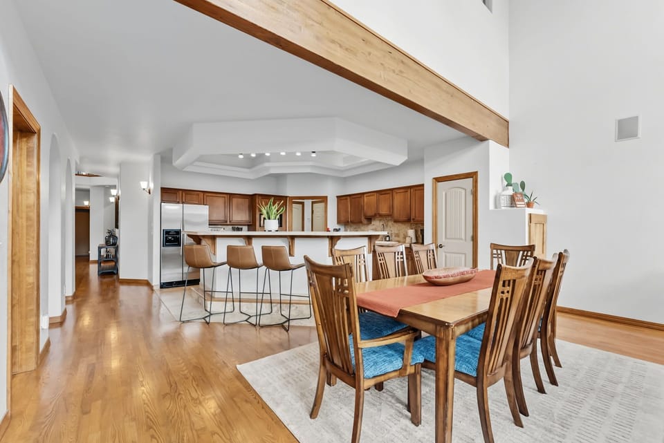 Dining area: 8-person dining table, open to kitchen and living area