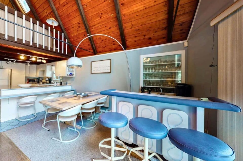 Enjoy serving guests at the bar in the cozy lakeside cabin! 