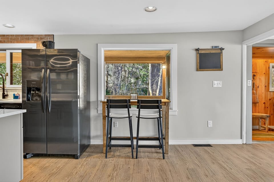 Bar seating and kitchen pass-through for casual meals.