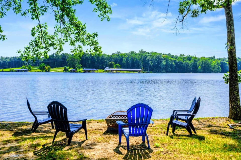 Lakeside Fire Pit - Adirondack chairs gather around the fire pit at the water's edge, ready for s'mores and stories long after sunset.