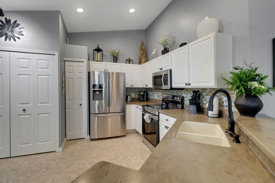 Cookware, dinnerware, many kitchen tools and small appliances are provided, including a Keurig coffee maker.