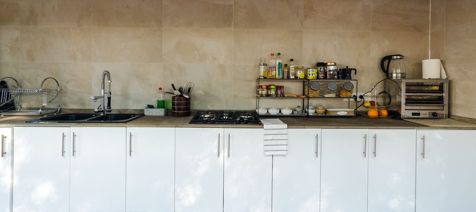 Espresso maker, shared fridge, shared microwave, highchair