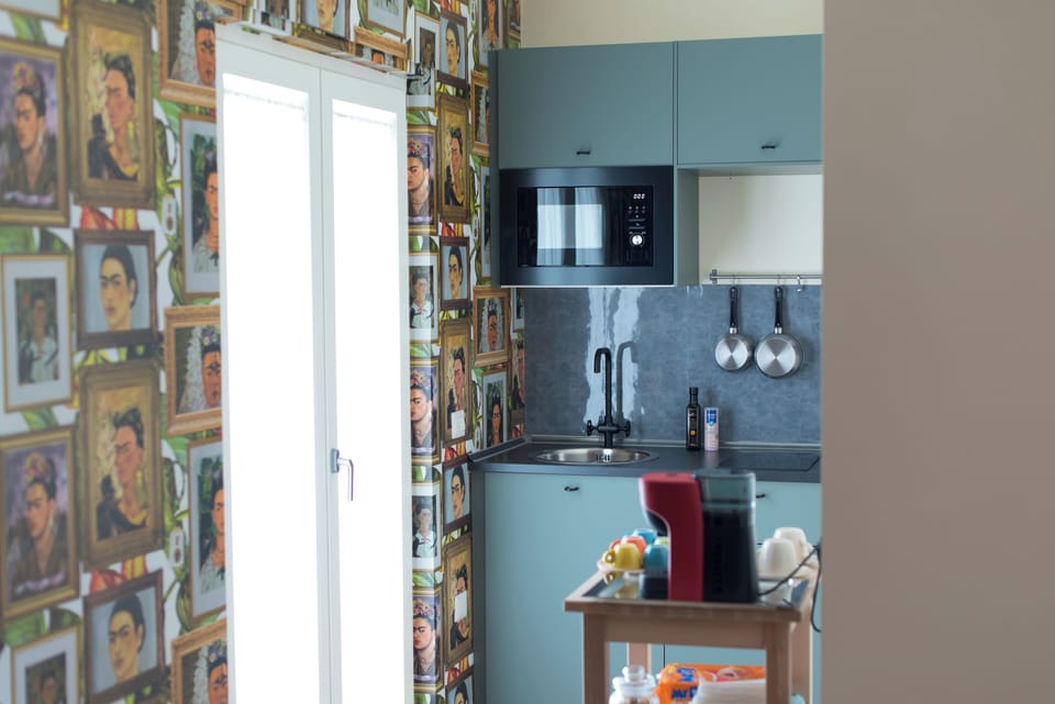 Mini-fridge, microwave, stovetop, coffee/tea maker