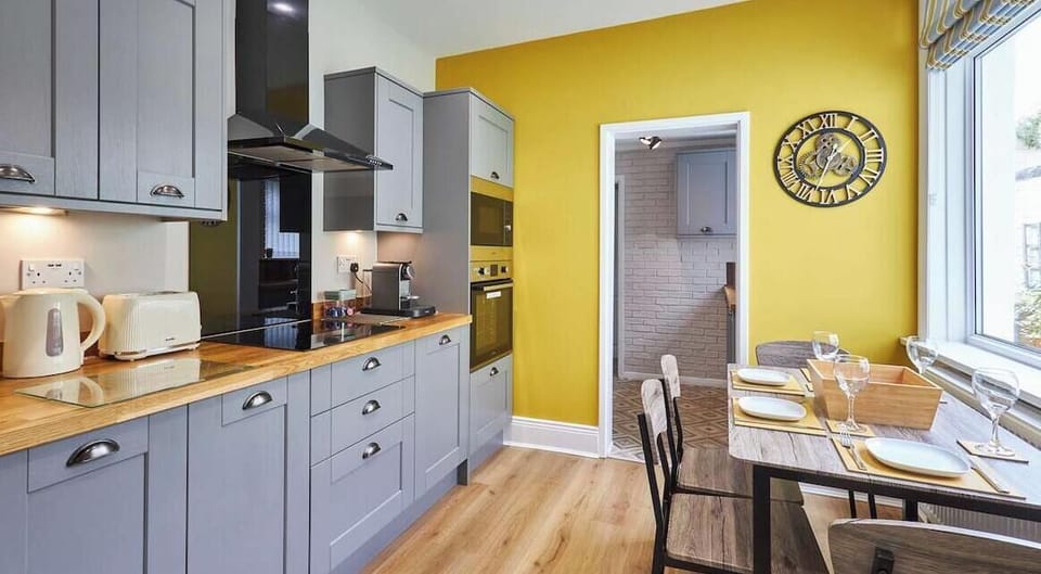 Fully equipped kitchen with sleek finishes and natural light.
