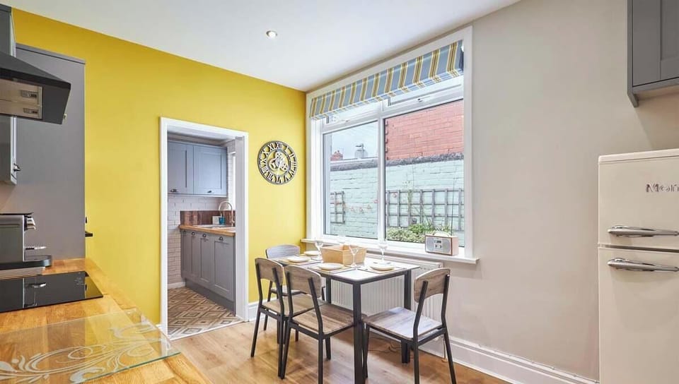 Cheerful dining nook connecting seamlessly to the kitchen.