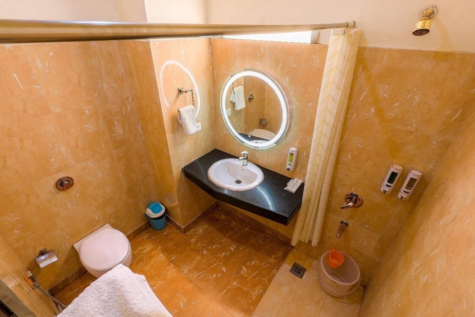Premium Room with Balcony | Bathroom | Shower, rainfall showerhead, bathrobes, slippers