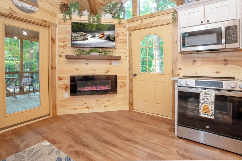 Living Room with Electric Fireplace and TV
