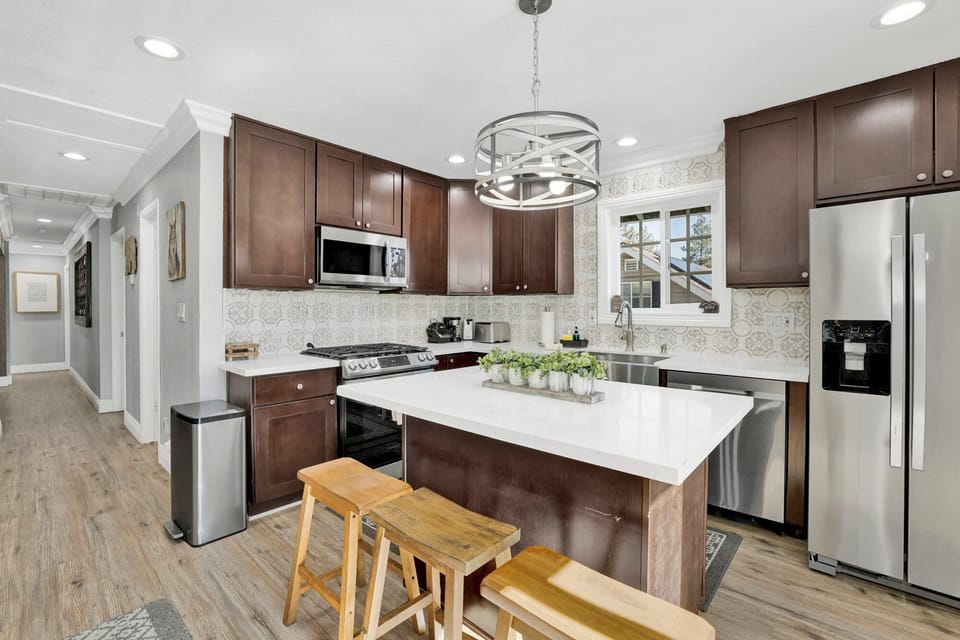 Fully equipped cabin kitchen with ample cabinetry, stove, fridge, microwave, and coffee maker—perfect for cooking meals, morning coffee, and feeling right at home on your stay.