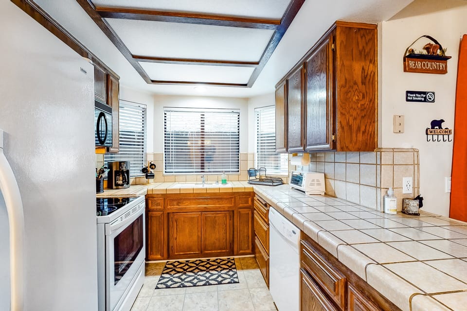 Spacious kitchen featuring clean design, ample storage, and natural light.
